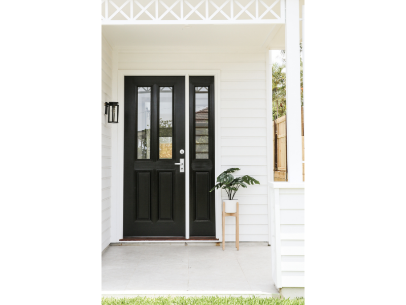Black front door in Hamptons Inspired Home