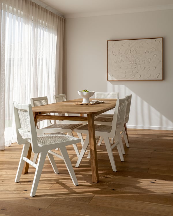 Dining Table with Timber Flooring and White Chairs in DC Living Brookhaven Display Home